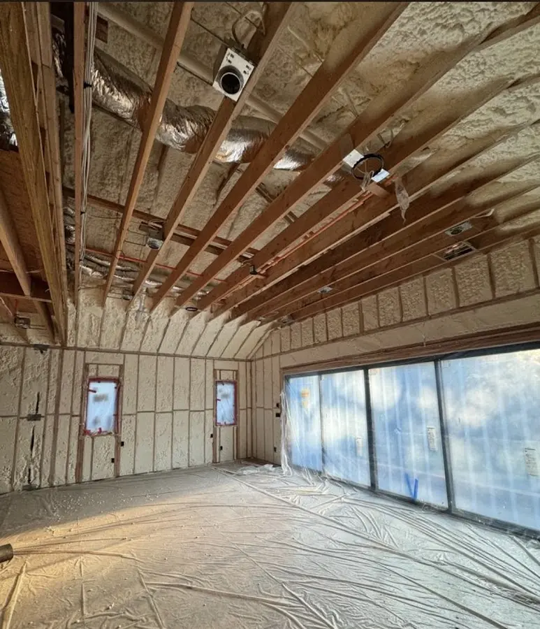 Interior walls and ceiling insulated with spray foam during new construction in Independent Hill